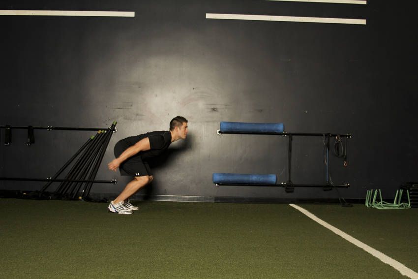 Broad Jump (Standing Long Jump) demonstration, start of the movement, targeting the glutes