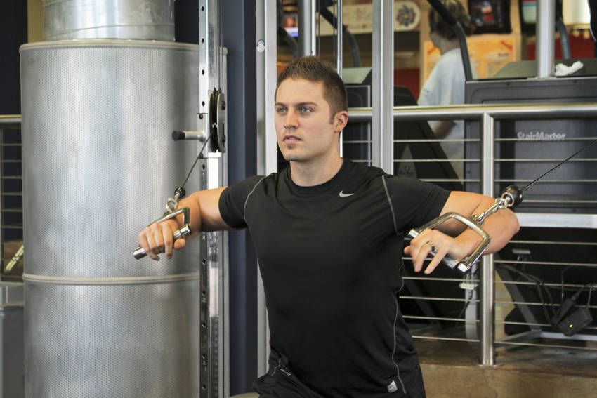 Standing Cable Chest Press demonstration, start of the movement, targeting the chest