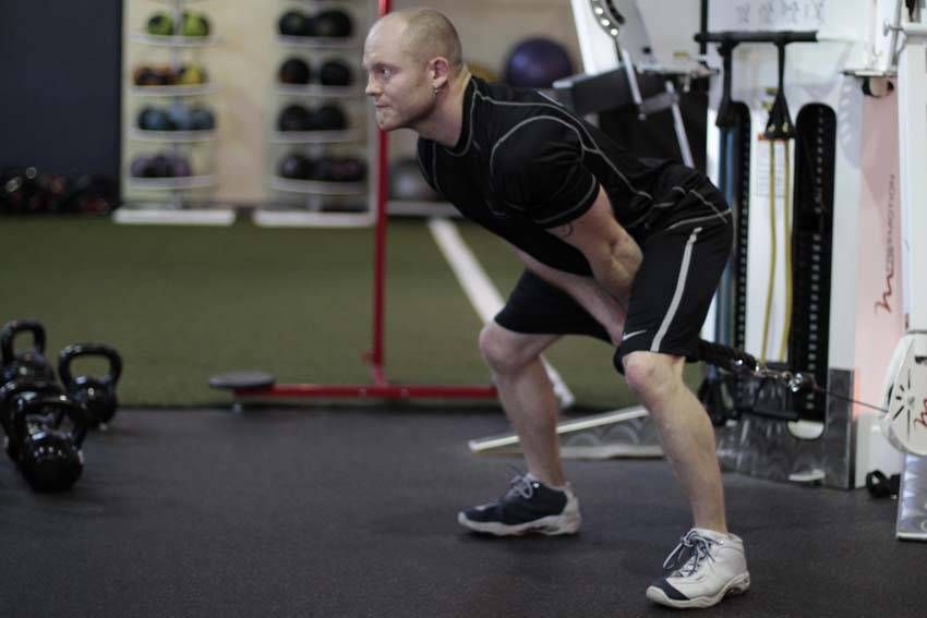 Cable Pull-Through demonstration, start of the movement, targeting the glutes