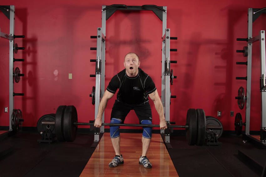 Clean and Jerk demonstration, start of the movement, targeting the quads