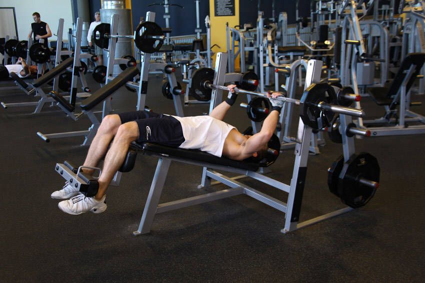 Decline Barbell Bench Press demonstration, start of the movement, targeting the chest