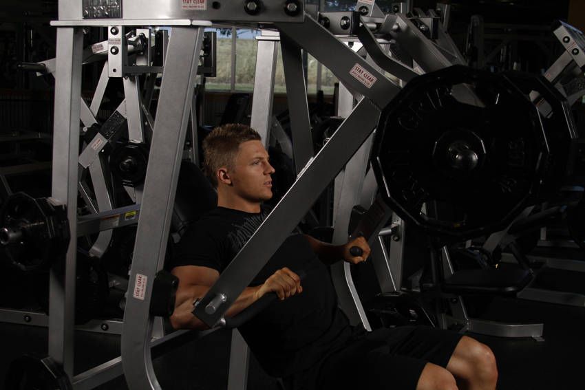 Decline Machine Chest Press demonstration, start of the movement, targeting the chest