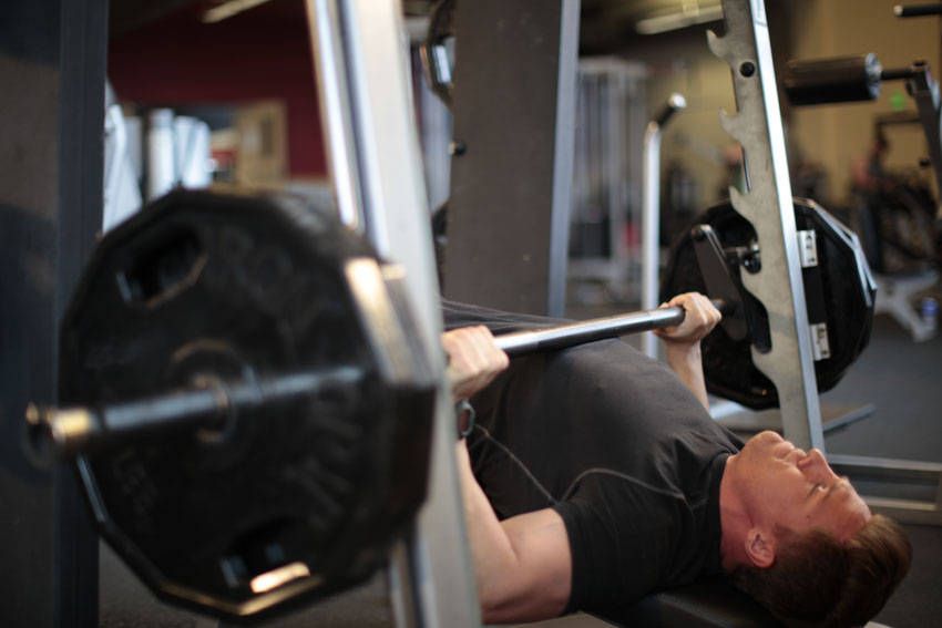 Decline Smith Machine Press demonstration, start of the movement, targeting the chest