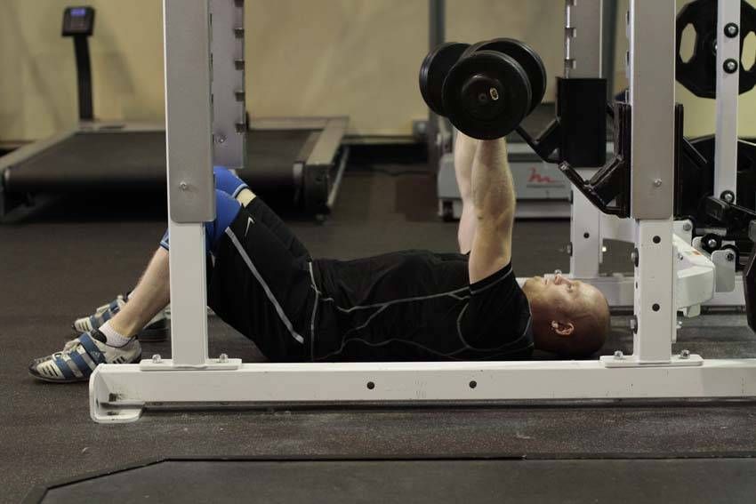 Dumbbell Floor Press demonstration, start of the movement, targeting the chest