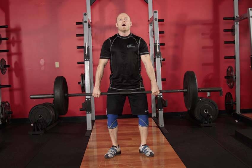 Hang Clean demonstration, start of the movement, targeting the quads