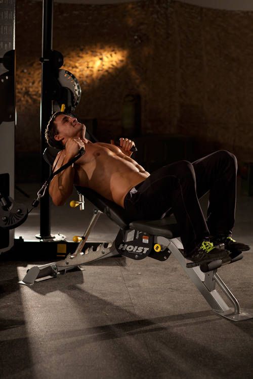 Incline Machine Chest Press demonstration, start of the movement, targeting the chest