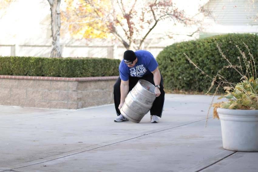Keg Load demonstration, start of the movement, targeting the back