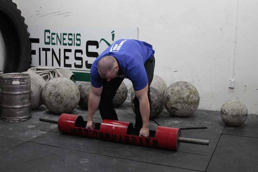 Log Clean and Press demonstration, start of the movement, targeting the shoulders