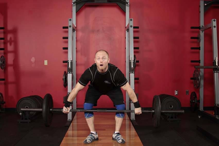 Muscle Snatch demonstration, start of the movement, targeting the traps