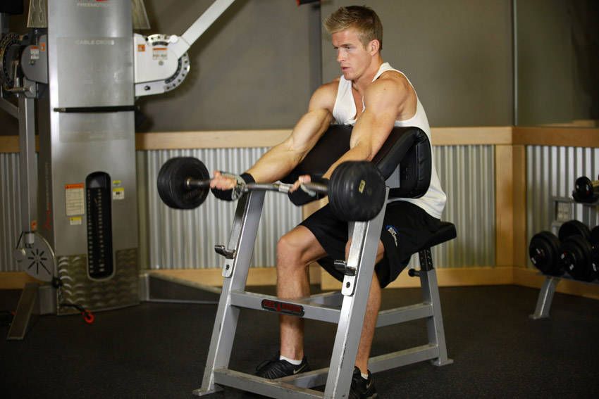 Preacher Curl demonstration, start of the movement, targeting the biceps