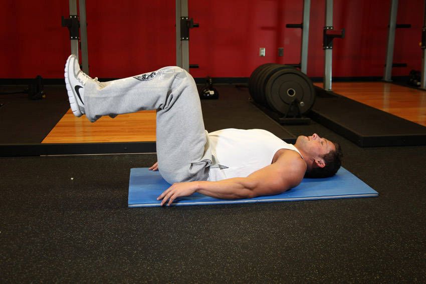 Reverse Crunch demonstration, start of the movement, targeting the abs