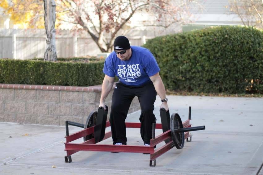 Rickshaw Carry demonstration, start of the movement, targeting the forearms