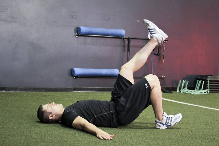Single-Leg Glute Bridge demonstration, start of the movement, targeting the glutes