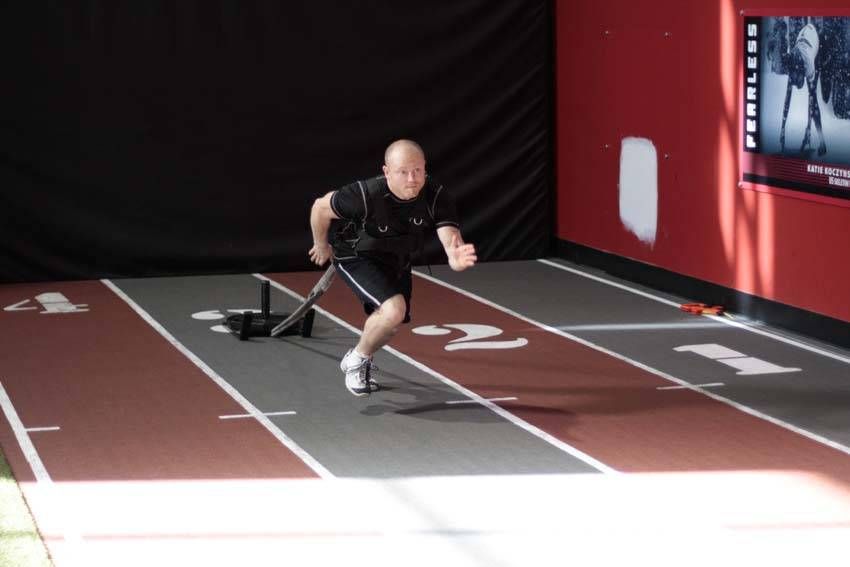 Sled Drag (Harness) demonstration, start of the movement, targeting the quads