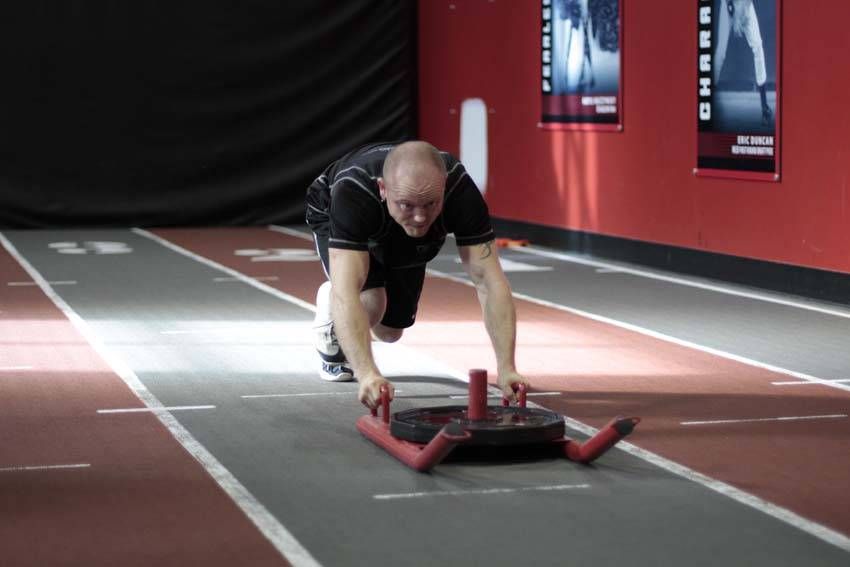 Sled Push (Prowler) demonstration, start of the movement, targeting the quads