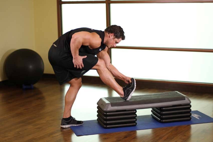 Standing Calf Stretch demonstration, start of the movement, targeting the calves