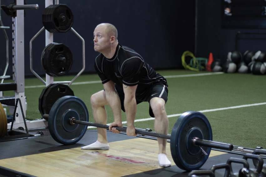 Sumo Deadlift demonstration, start of the movement, targeting the glutes