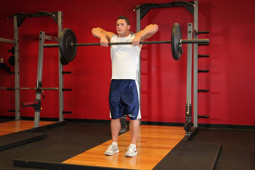 Barbell Upright Row demonstration, start of the movement, targeting the shoulders